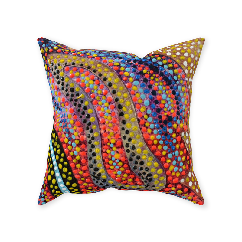 deep blue throw pillow with floating bright orange bars.