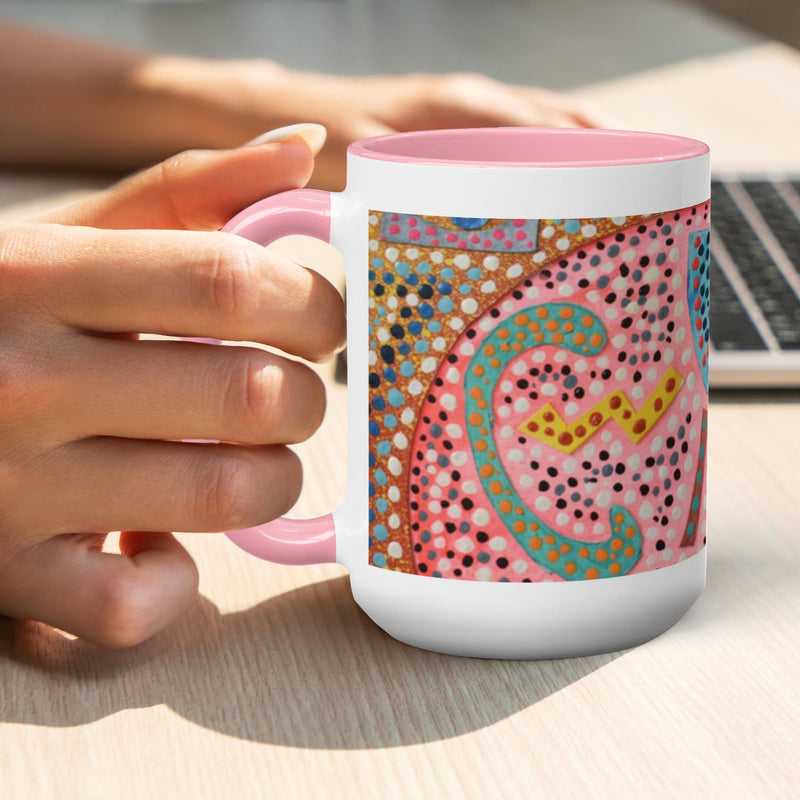 pink coffee mug with a pink and gold mosaic print.